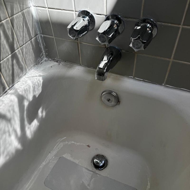 Price Pfister shower valve with three handles and tub spout