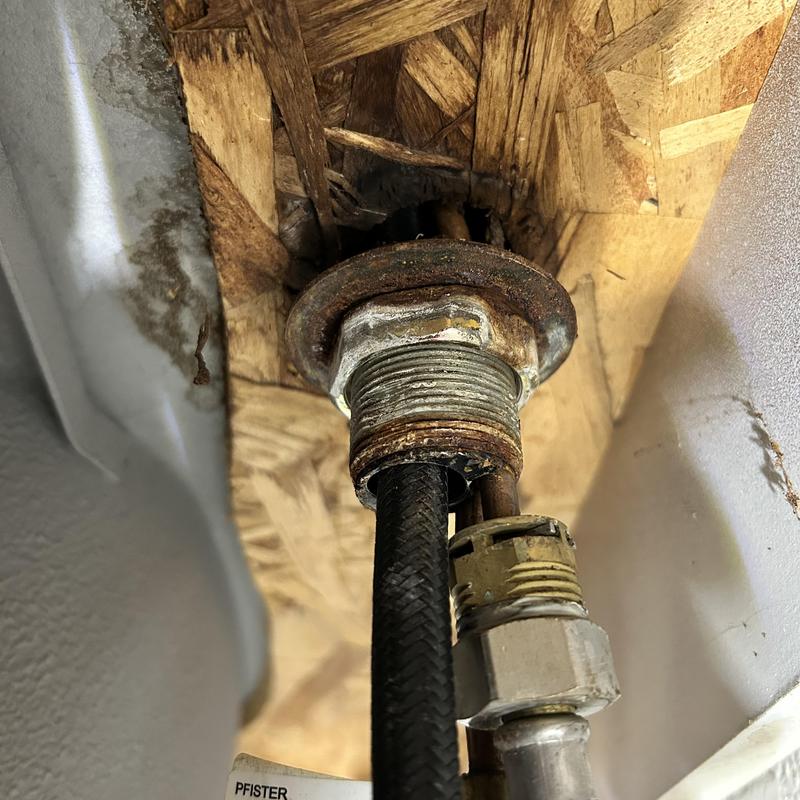 Kitchen sink faucet mounting hardware and supply lines