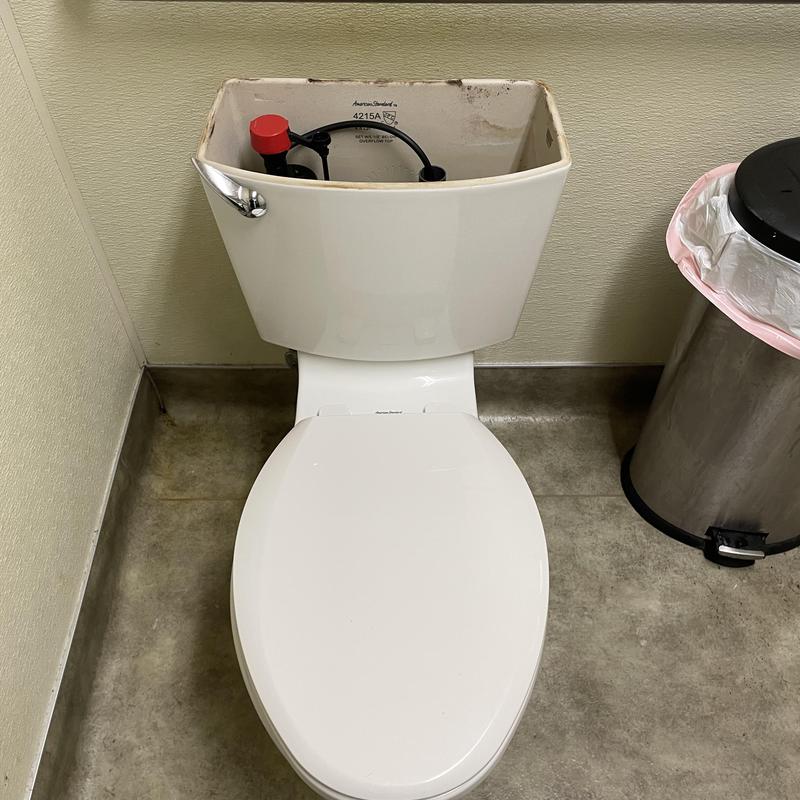 Toilet tank with new fill valve installed