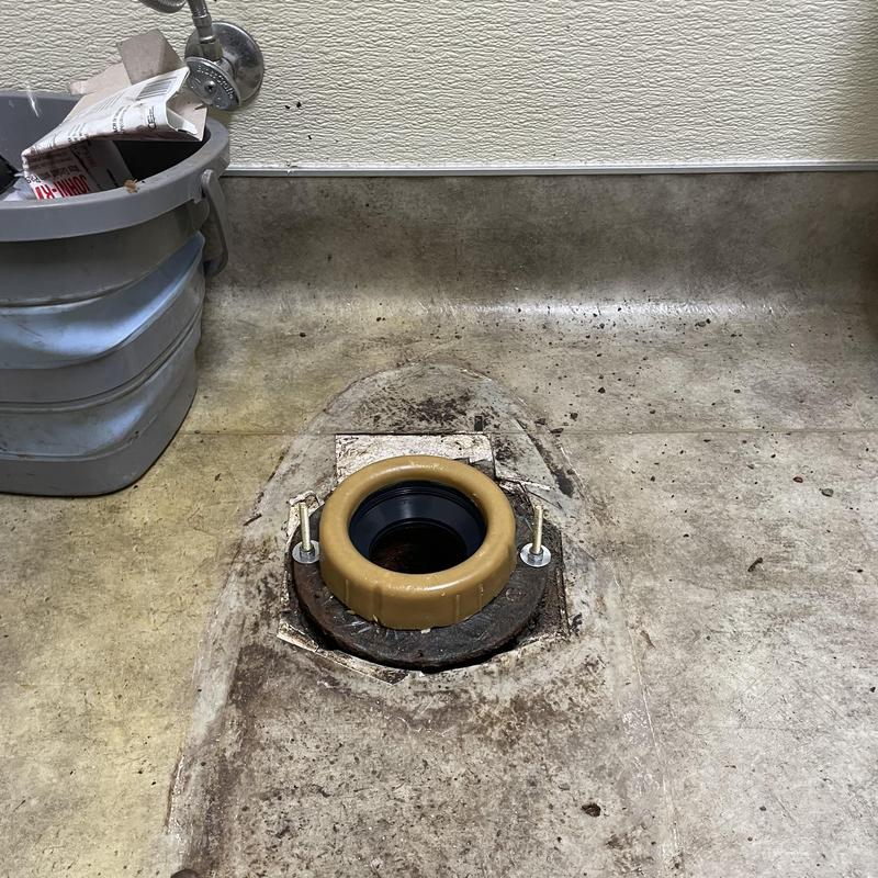 Toilet flange and wax ring installation in commercial restroom