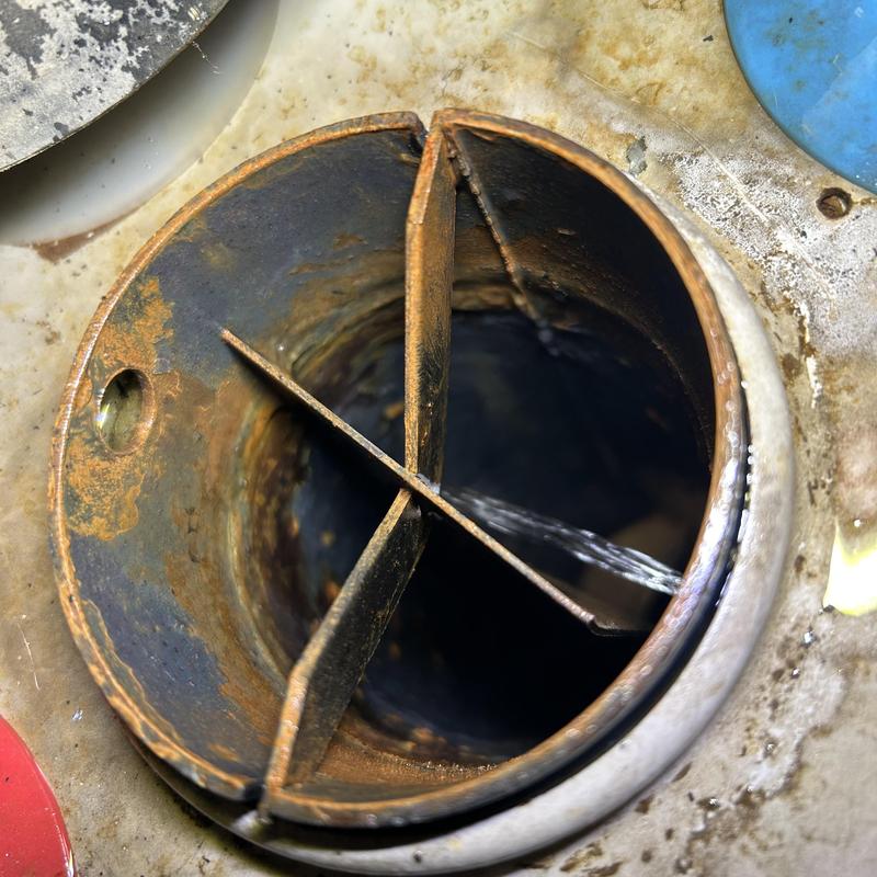 Water heater tank leaking from inner seam close-up
