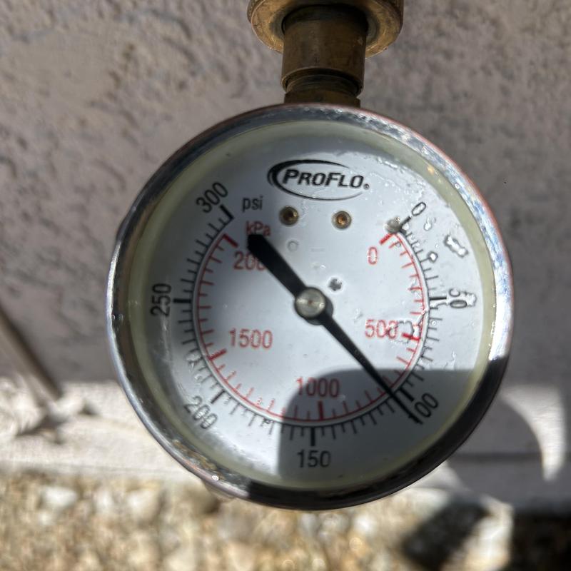 Water pressure gauge showing high pressure reading