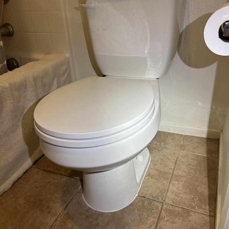 Toilet with new wax ring and hardware installation