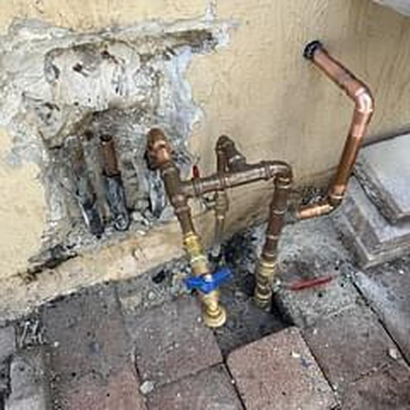 Copper water supply lines with new valve installation outdoors