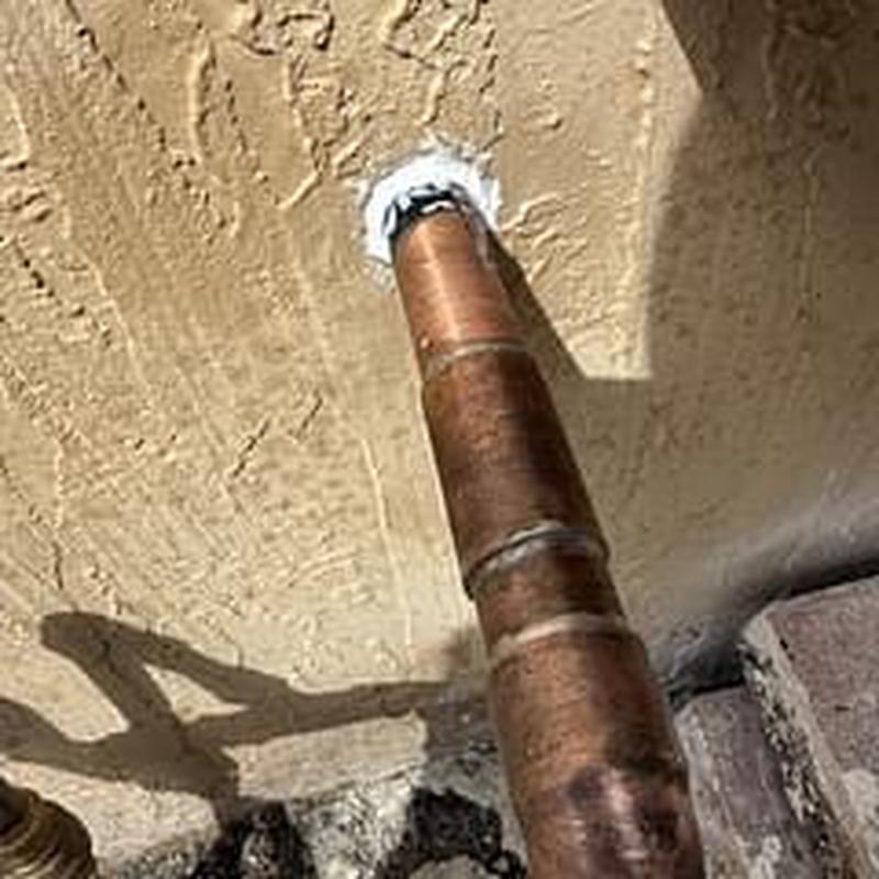 Copper cold water line capped in exterior wall near valve