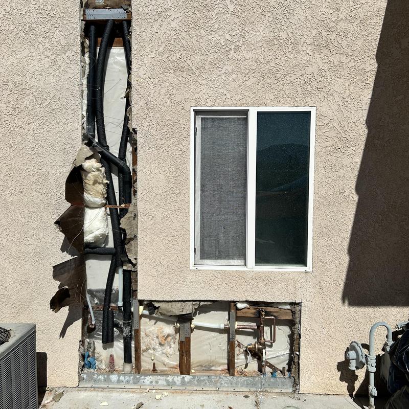 Water supply pipe reroute with insulation in wall cavity