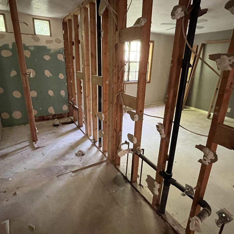 Residential drainage system rough-in during remodel walkthrough