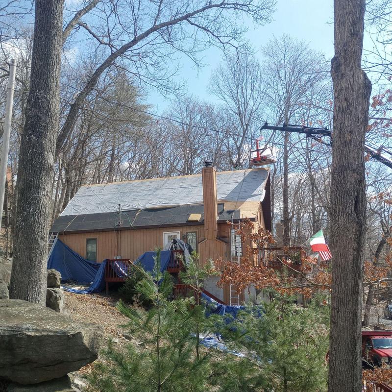 Roof underlayment installation on residential house Roof underlayment installation on residential house