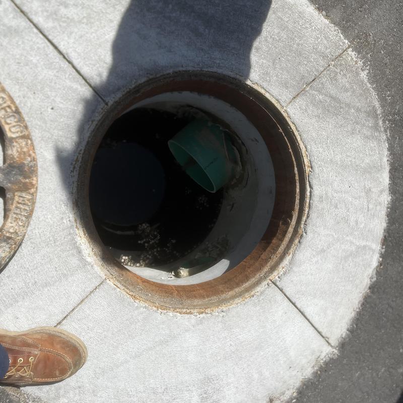 Storm drain basin inspection showing minor debris inside