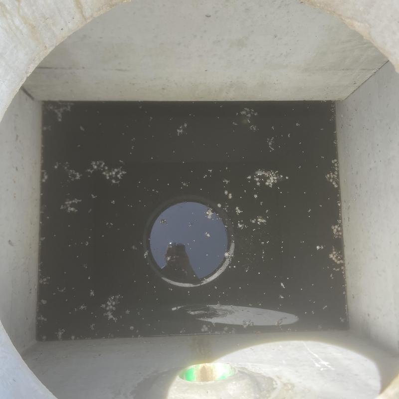 Storm drain basin inspection showing minimal debris