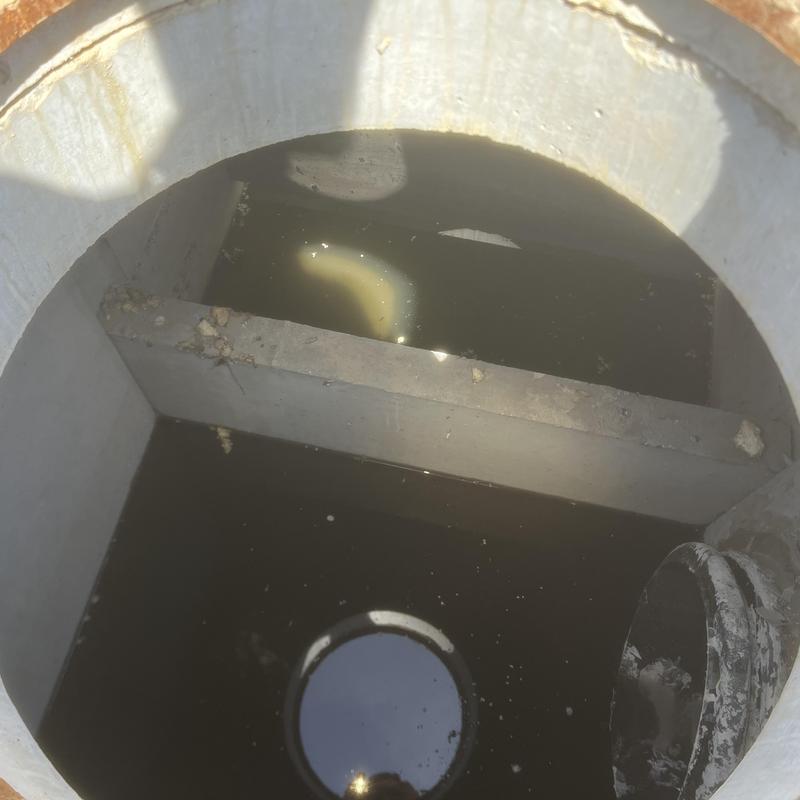 Storm drain basin inspection with minor debris present