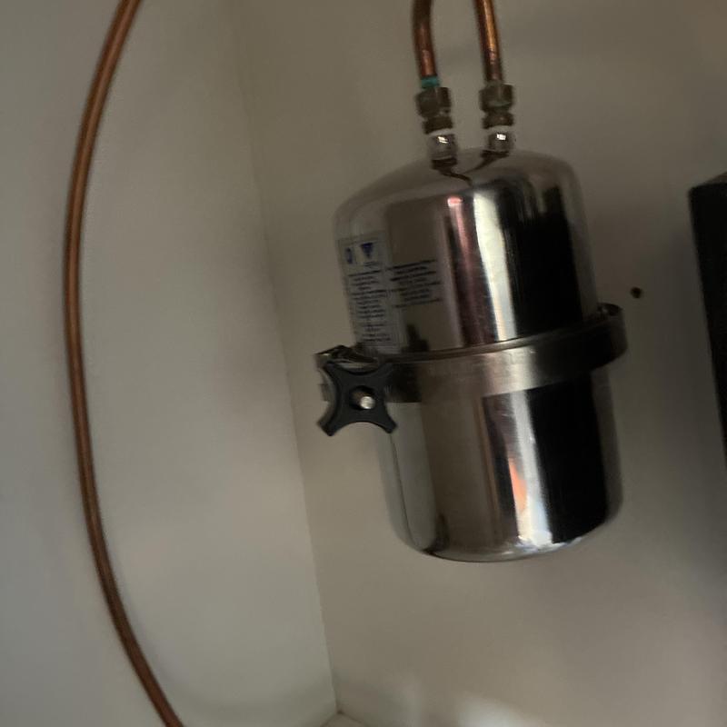Under-sink water filtration system installation with copper pipes