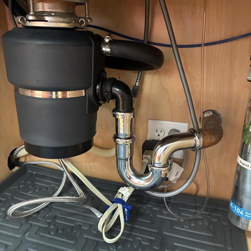 Garbage disposal and water filtration installation under sink
