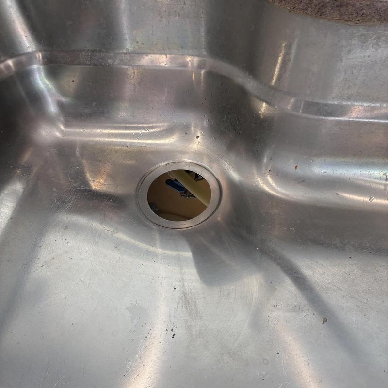 Kitchen sink disposal mounting flange installed under sink