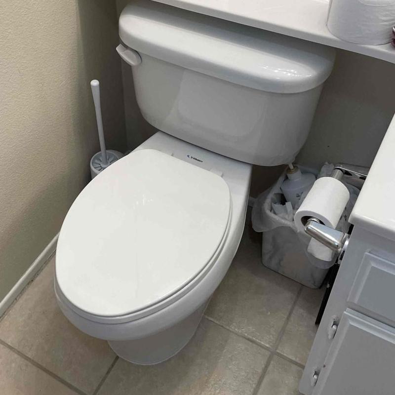 Toilet with new wax ring seal and supply line