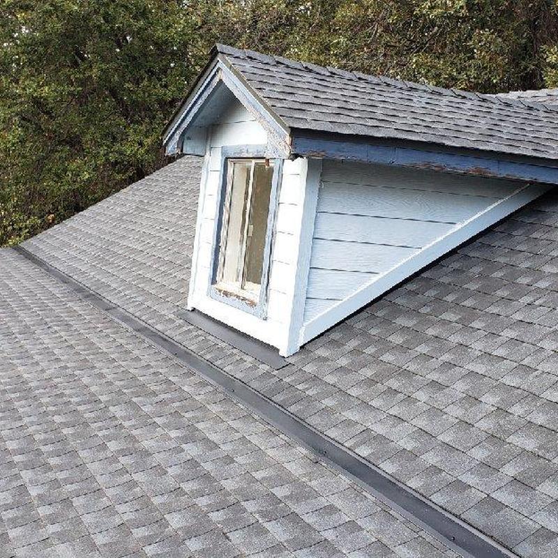 Asphalt shingle roof with dormer window replacement