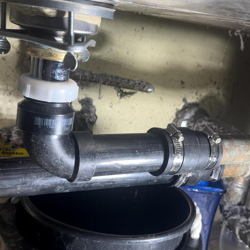 ABS plumbing installation under three compartment sink