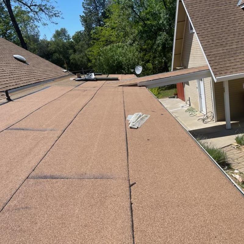 Torch down flat roof installation on residential house