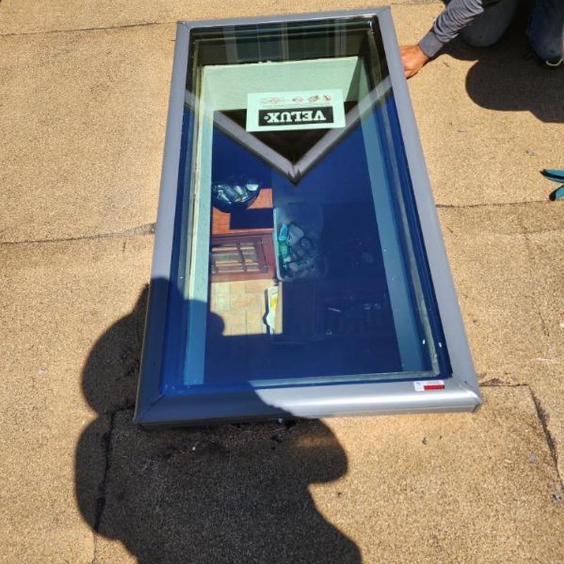 Velux skylight window installed on torch down roof