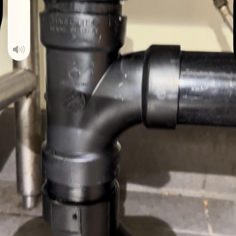 ABS drain pipe replaced under sink in kitchen