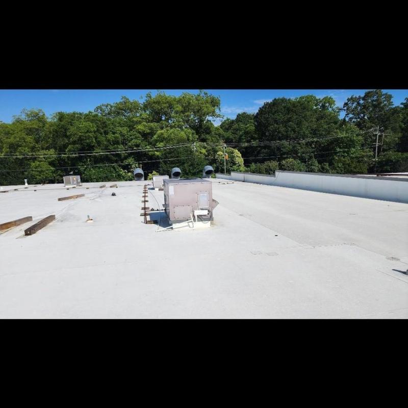 TPO roof with HVAC unit and vent pipes TPO roof with HVAC unit and vent pipes