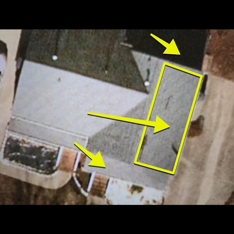 Roof section with repair points marked by drone arrows Roof section with repair points marked by drone arrows