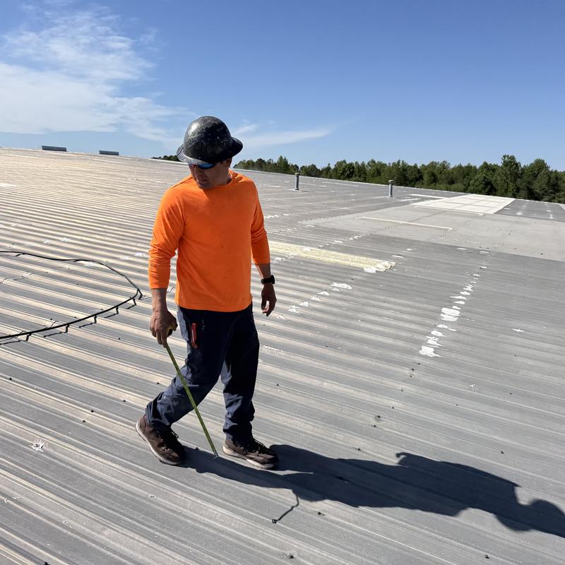 Metal roof fasteners inspection on industrial building