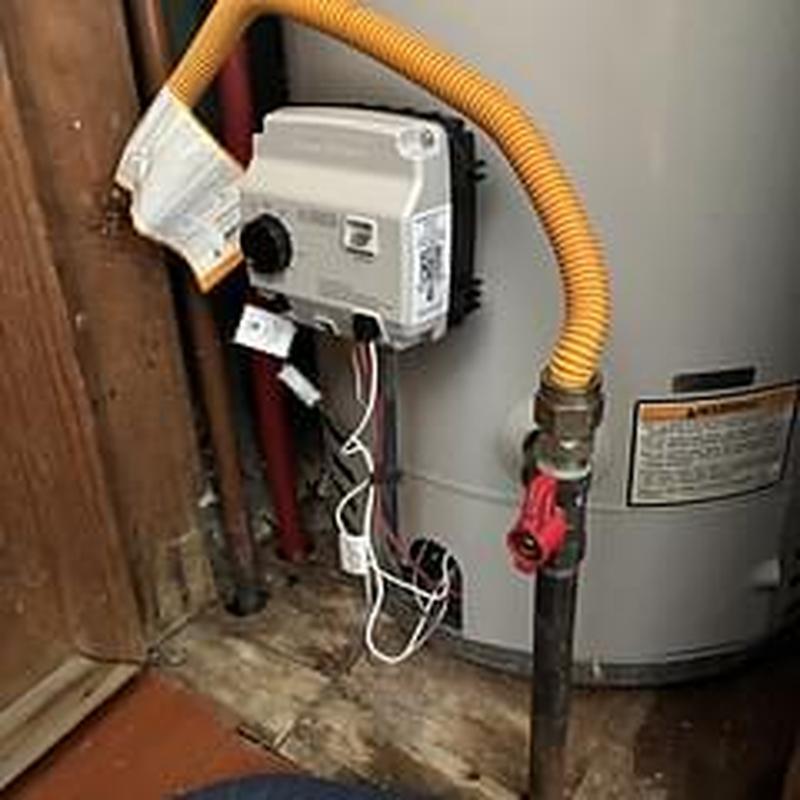 Gas control valve on water heater with yellow tubing