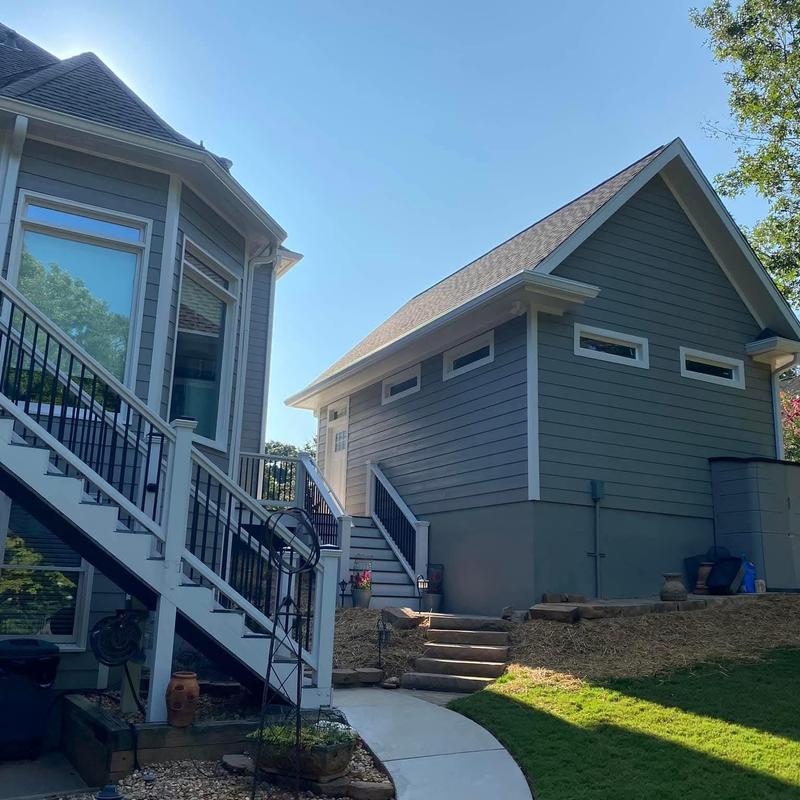 Asphalt shingle roof on detached garage with new siding