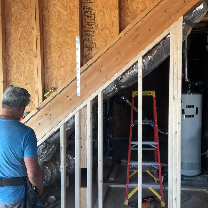 Attic framing and insulation installation under stairwell