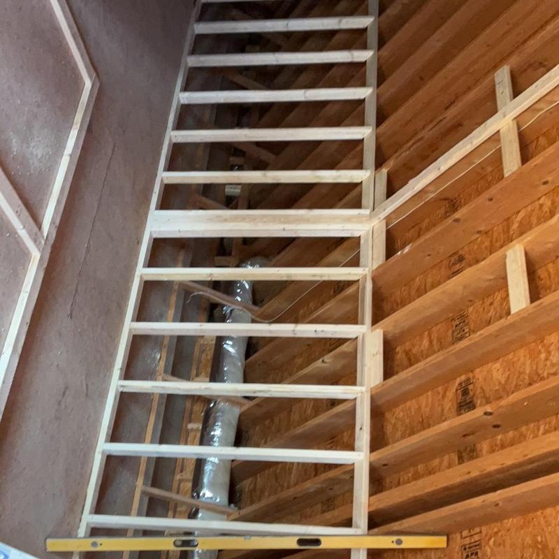 Attic framing and ductwork installation in progress