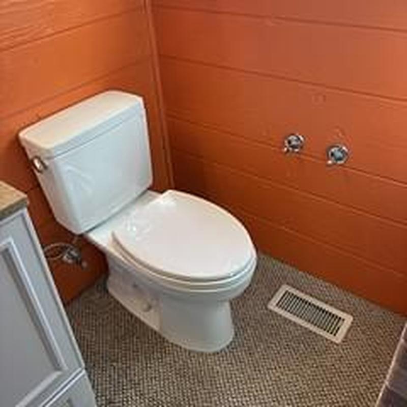 Toto Drake ADA elongated toilet installation in bathroom