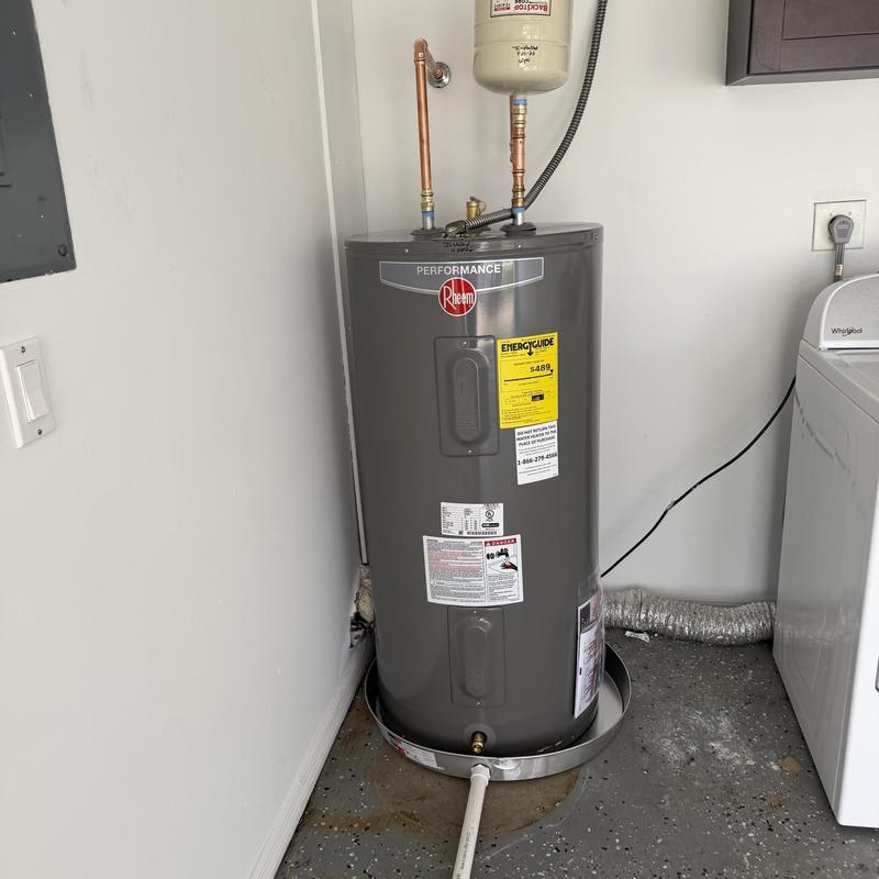 Electric water heater with expansion tank and pan installed