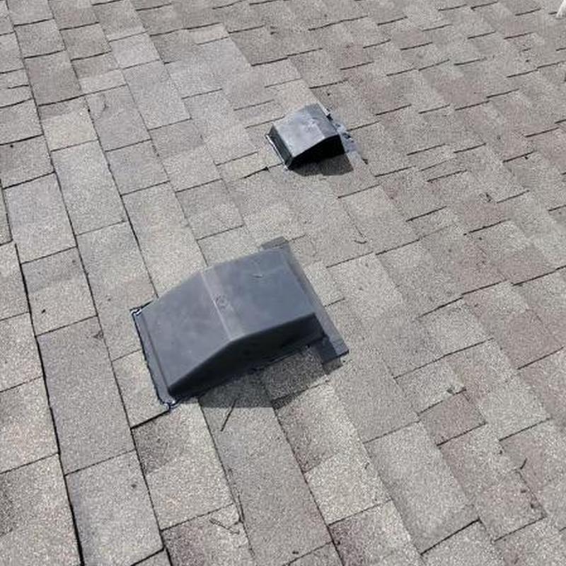 Dryer vent with new flashing on asphalt roof