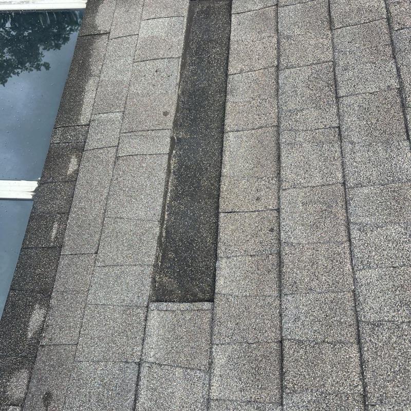 Asphalt shingles with damaged and missing sections Asphalt shingles with damaged and missing sections