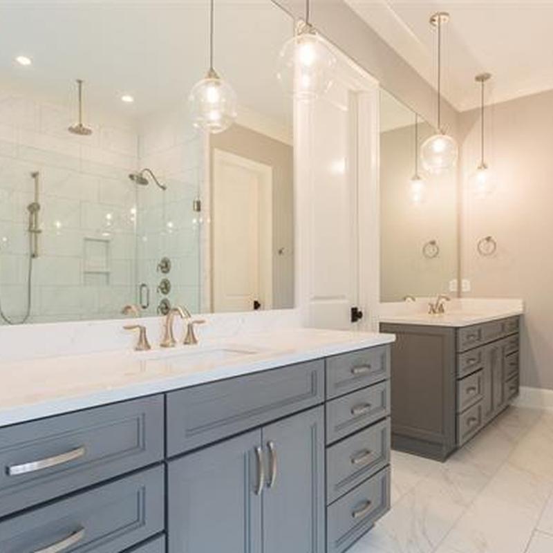 Bathroom vanity cabinets and quartz countertops with lighting