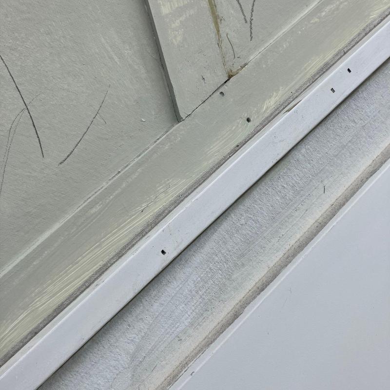 Roof flashing with drilled holes and worn paint