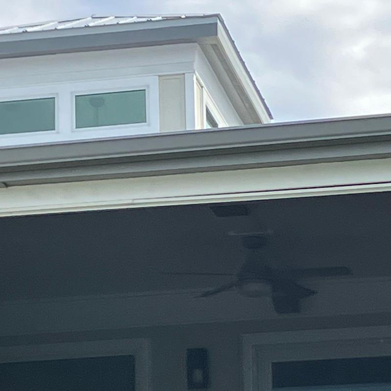 Metal roof seam sealing on residential home in Florida