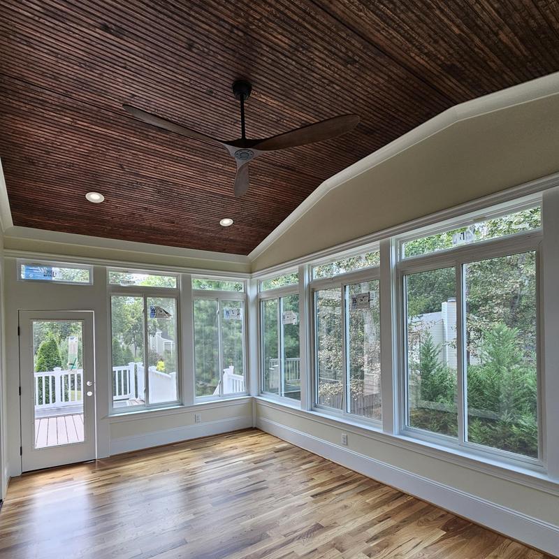 Wood ceiling with fan and large windows installation Wood ceiling with fan and large windows installation