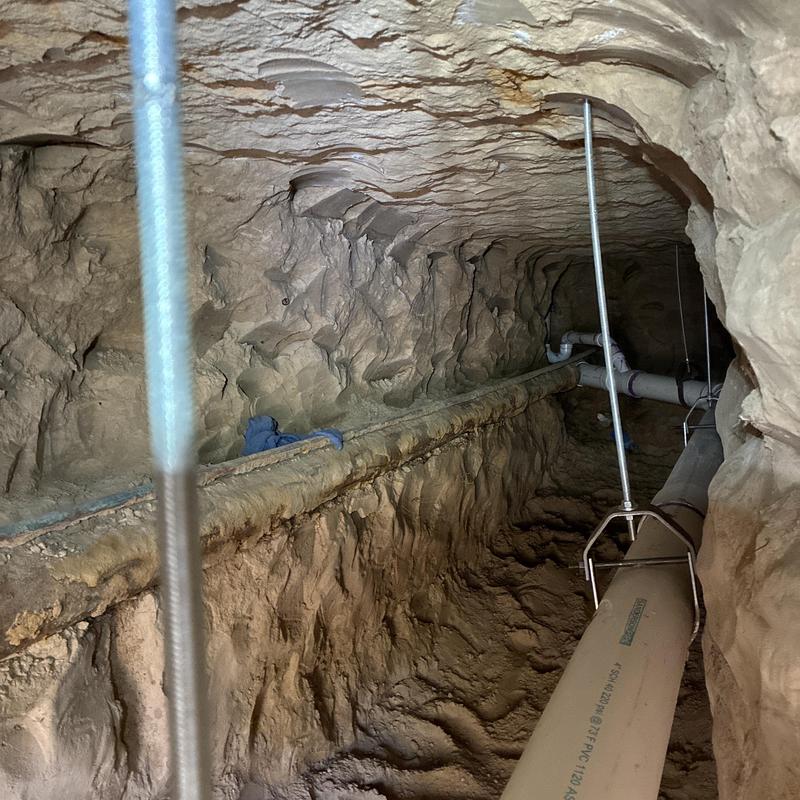 Sewer line under-slab tunneling and pipe installation