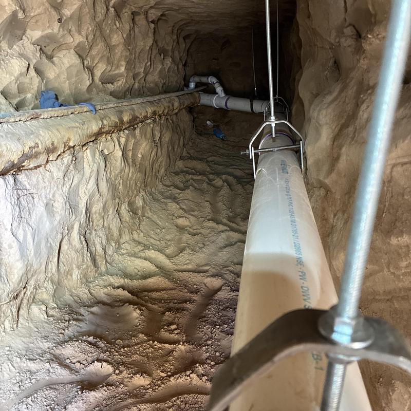 PVC sewer line installation in under-slab tunnel