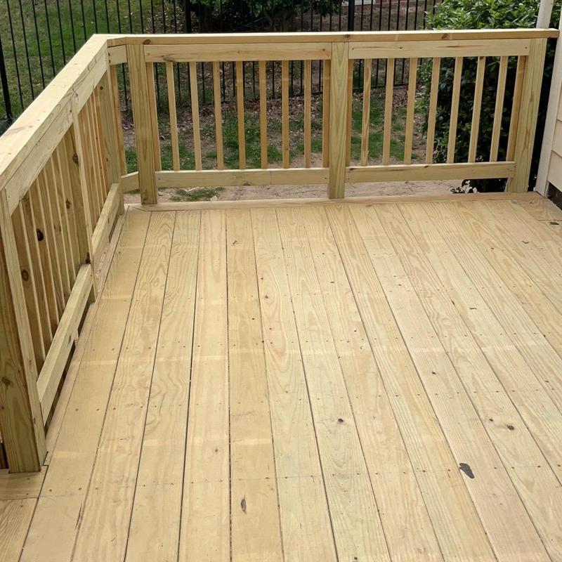Wooden deck flooring with railing installation