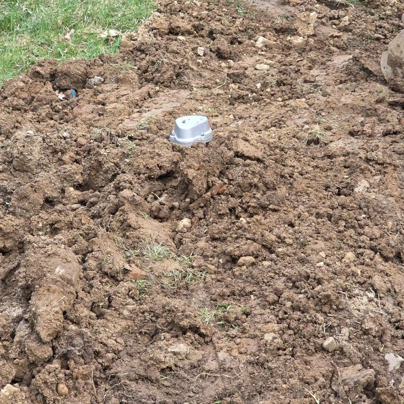 Wellhead installation in freshly dug soil