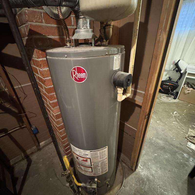 Water heater installation with plumbing connections