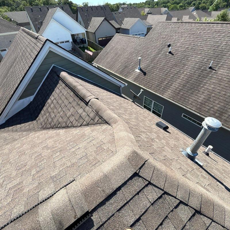 Asphalt shingle roof with ridge cap and vents inspection