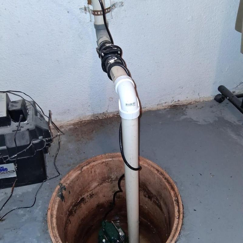 Sump pump system installation in basement floor pit