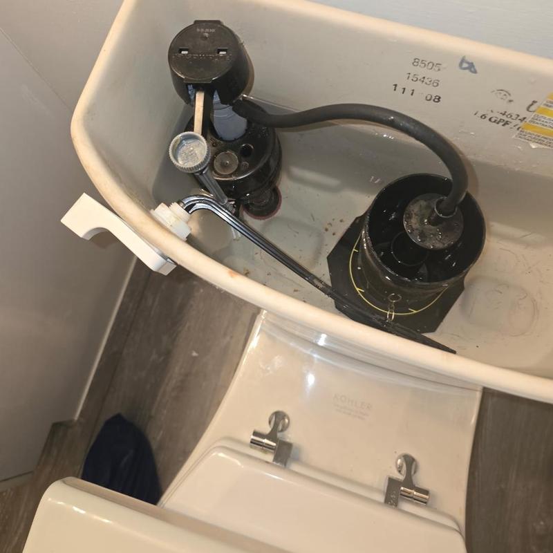 Toilet flush valve and fill valve inside tank
