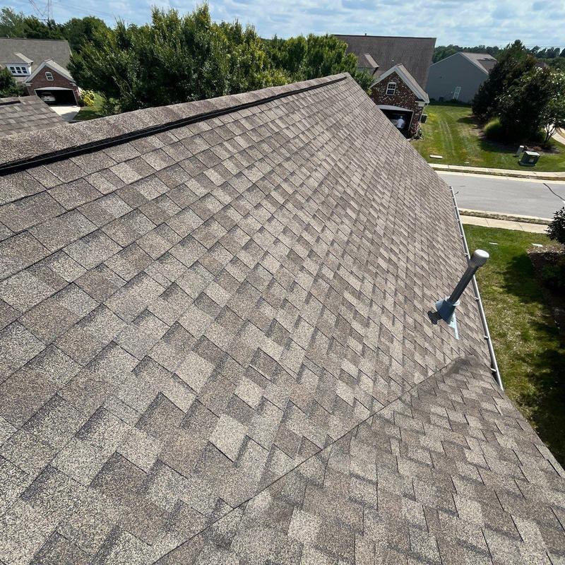 Asphalt shingle roof with vent pipe and gutter system
