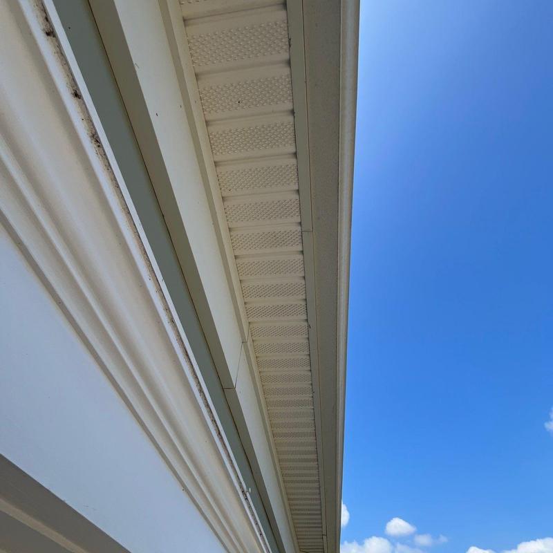 Roof soffit and fascia with clear sky background