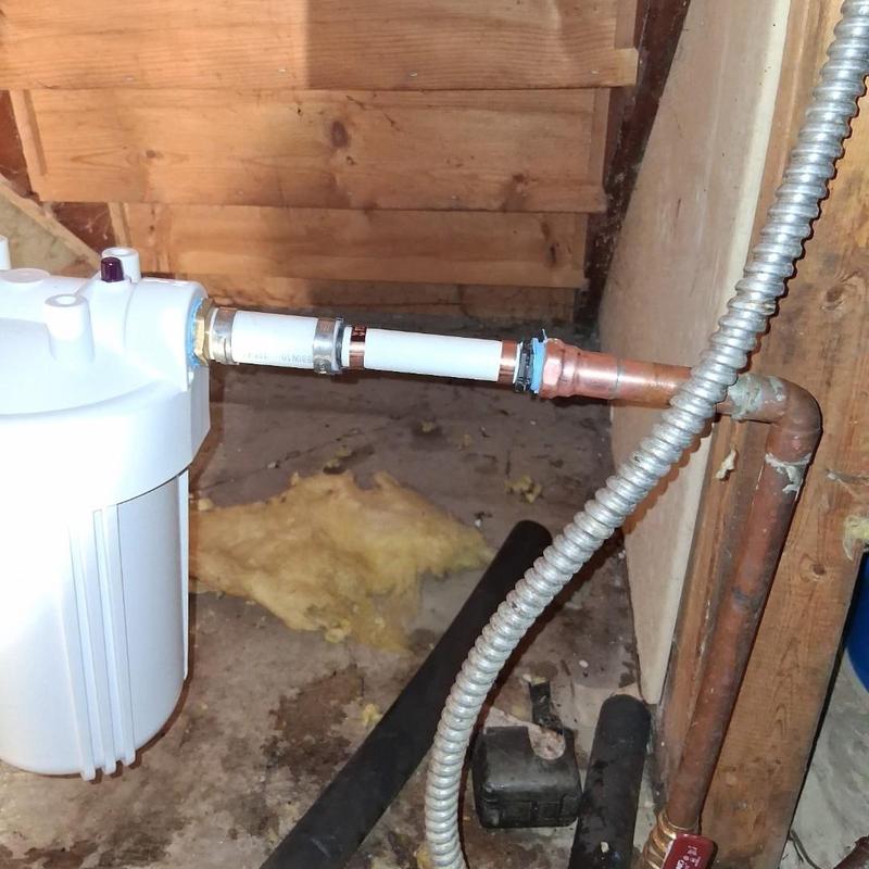 Sterling water filter housing and copper piping installation